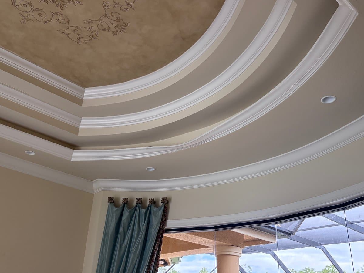 Ornate tray ceiling with damaged crown molding section