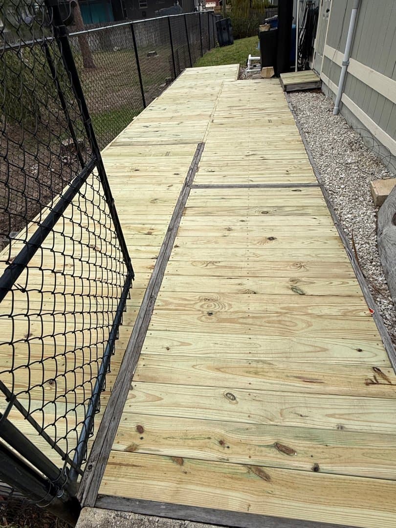 New pressure-treated lumber walkway with clean boards installed