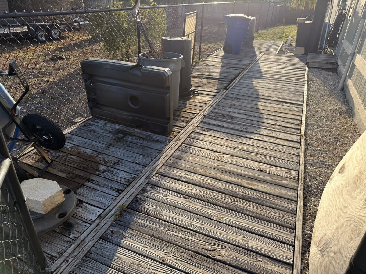 Rotted and weathered wood walkway in disrepair
