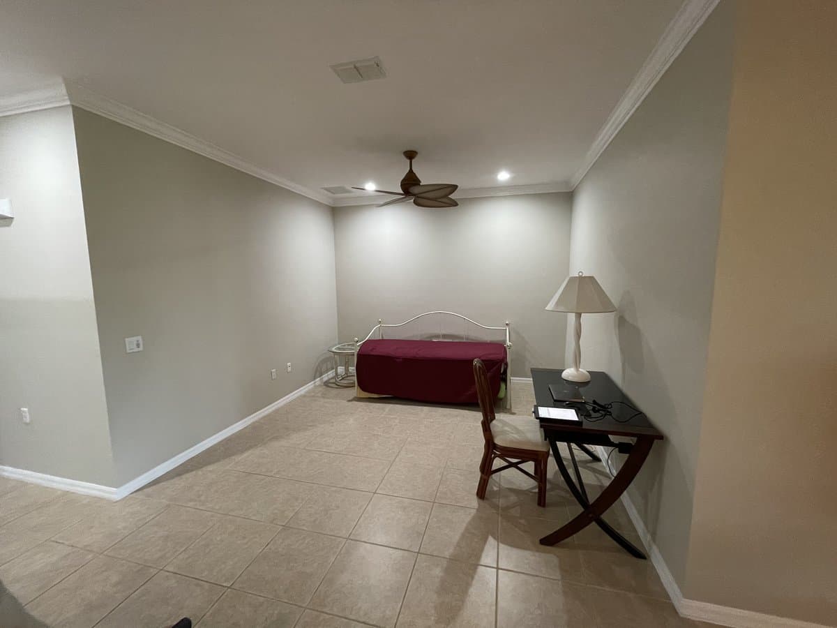 Open room with ceiling fan, recessed lighting, and tile flooring before wall was added