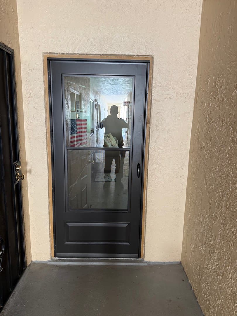 New modern full-view glass storm door installed